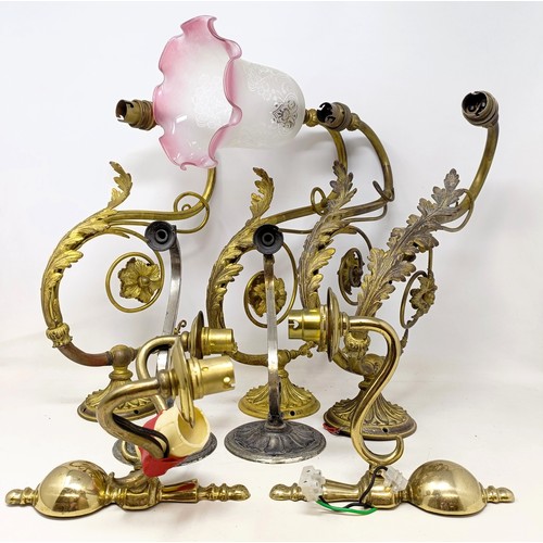 777 - A gilt metal two branch wall light, 36 cm wide, a pair of matching single wall lights, a pair of sil... 