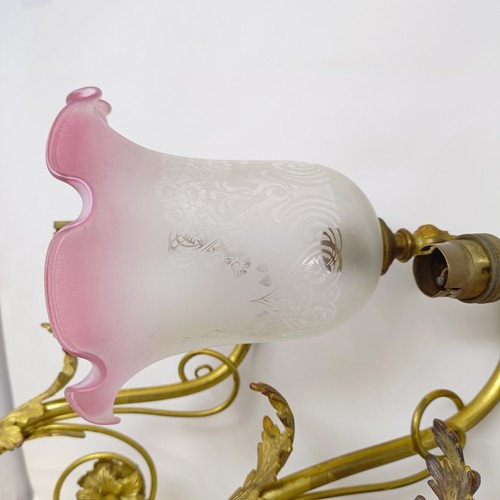 777 - A gilt metal two branch wall light, 36 cm wide, a pair of matching single wall lights, a pair of sil... 