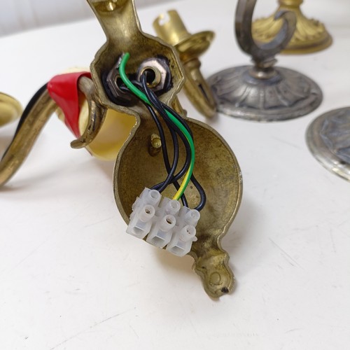 777 - A gilt metal two branch wall light, 36 cm wide, a pair of matching single wall lights, a pair of sil... 