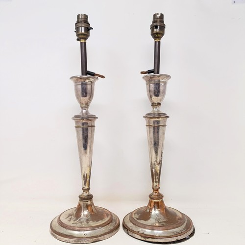 781 - A pair of silver plated candlesticks, converted to lamps, 46 cm high (2)