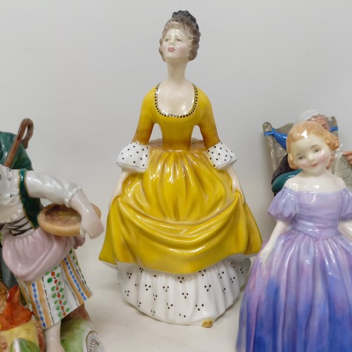 786 - ***Regretfully Withdrawn*** Assorted Royal Doulton figures, film photographs, and assorted postcards... 