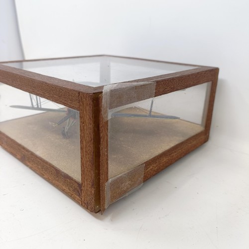 778 - A model of an RAF bi-plane, in a glass case, 19 cm wide