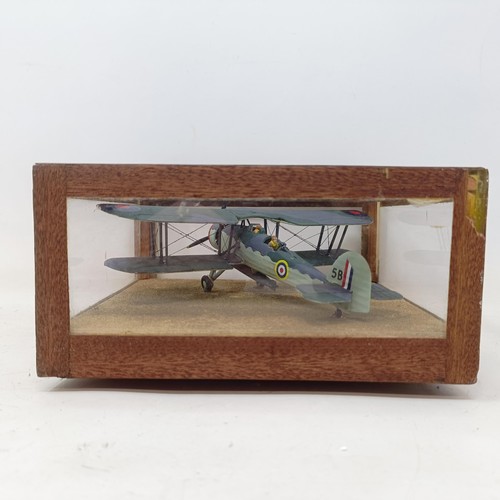 778 - A model of an RAF bi-plane, in a glass case, 19 cm wide