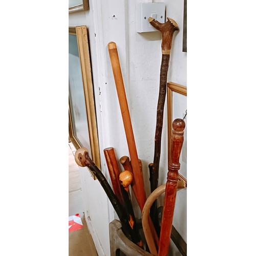 854 - Assorted walking sticks and a warming pan