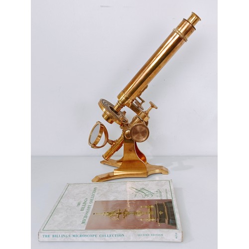 859 - A late 19th/early 20th century brass monocular microscope, 48 cm high