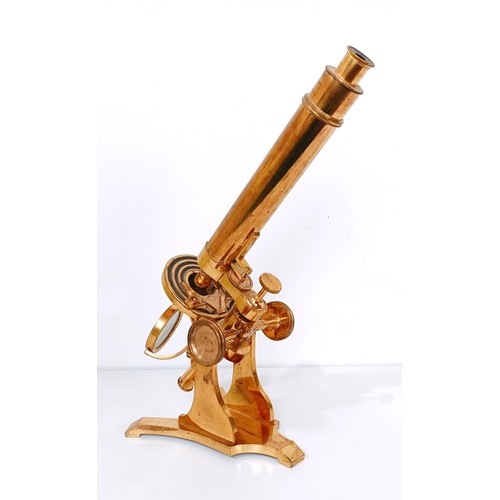 859 - A late 19th/early 20th century brass monocular microscope, 48 cm high