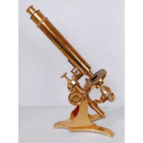 859 - A late 19th/early 20th century brass monocular microscope, 48 cm high