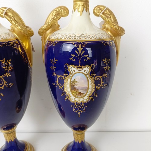 875 - A pair of early 20th century Coalport vases, the deep blue grounds with central cartouches, decorate... 