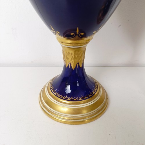 875 - A pair of early 20th century Coalport vases, the deep blue grounds with central cartouches, decorate... 