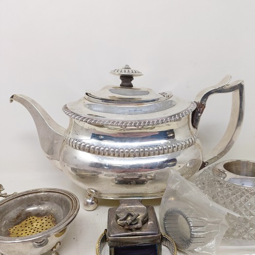 877 - A George III silver teapot, a cut glass match strike, with a silver mount, a silver plated tea strai... 