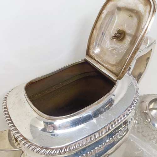 877 - A George III silver teapot, a cut glass match strike, with a silver mount, a silver plated tea strai... 