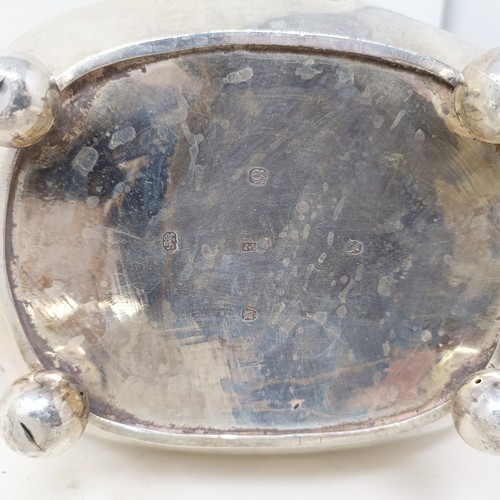877 - A George III silver teapot, a cut glass match strike, with a silver mount, a silver plated tea strai... 