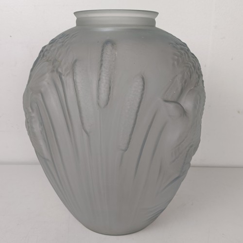 801A - An opaque glass vase, decorated birds and bulrushes, 30 cm high and two Carnival glass bowls, 23 cm ... 