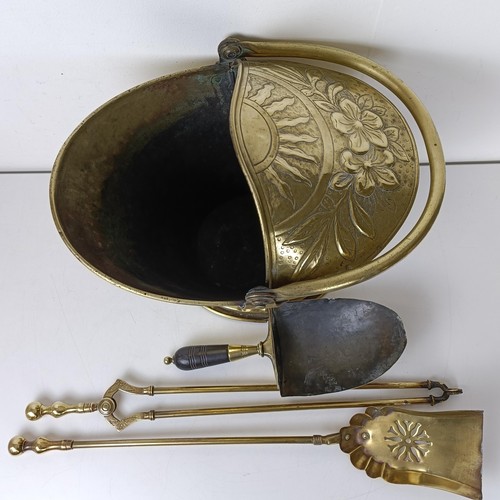 800A - A brass coal scuttle, a shovel and two fire irons (4)