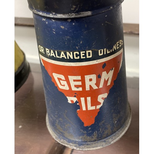 32 - A Germ Oils jug, 23.5 cm high, and another similar, re-painted, 42 cm highPlease see our terms and c... 