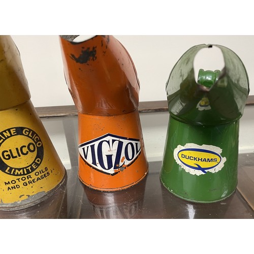 45 - A Morris Shrewsbury Golden Film Lubricants oil jug, 17.5 cm high, and three others (4)Please see our... 