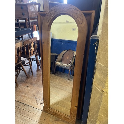 1325 - A pine framed wall mirror, 142 x 61 cm, and another and a painted dumb porter, 92 cm high (3)
