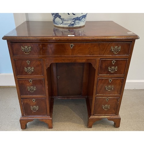 1324 - A George III style mahogany kneehole desk, 80 cm wide