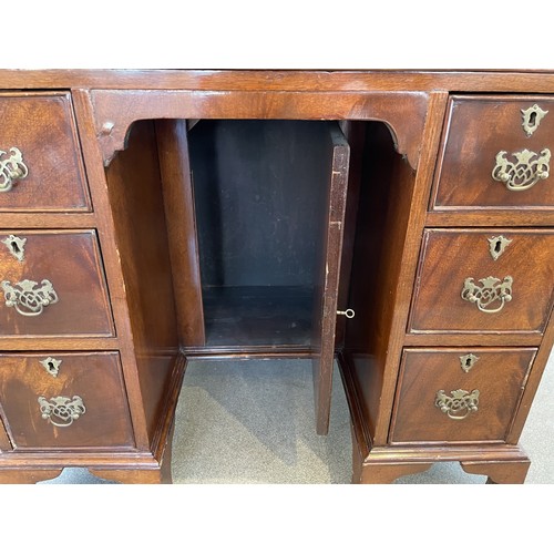 1324 - A George III style mahogany kneehole desk, 80 cm wide