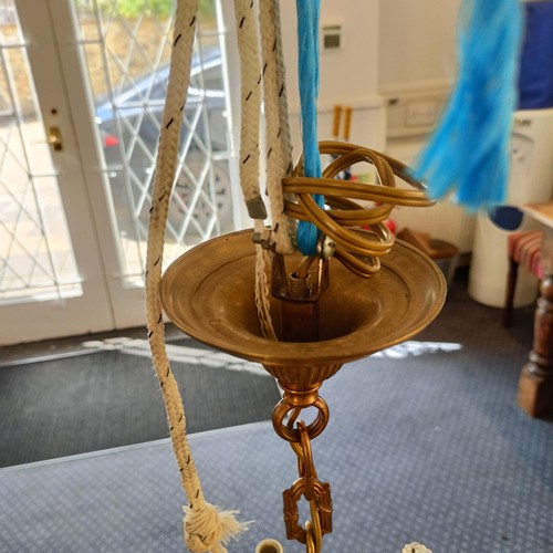 1322 - A brass chandelier, with cut glass drops, 50 cm diameter approx.
