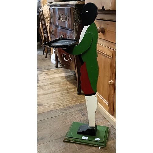 1325 - A pine framed wall mirror, 142 x 61 cm, and another and a painted dumb porter, 92 cm high (3)
