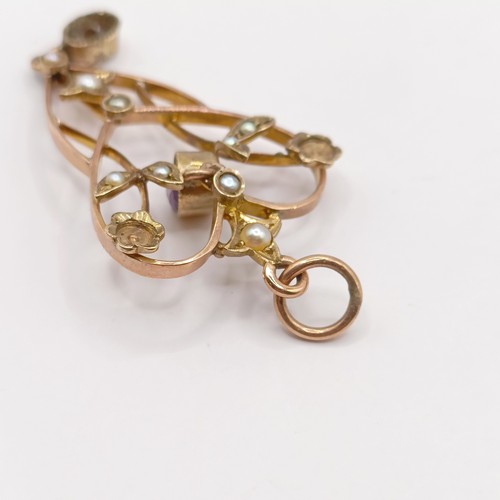 727 - A early 20th century yellow metal, amethyst and seed pearl pendant, 40 mm long approx.