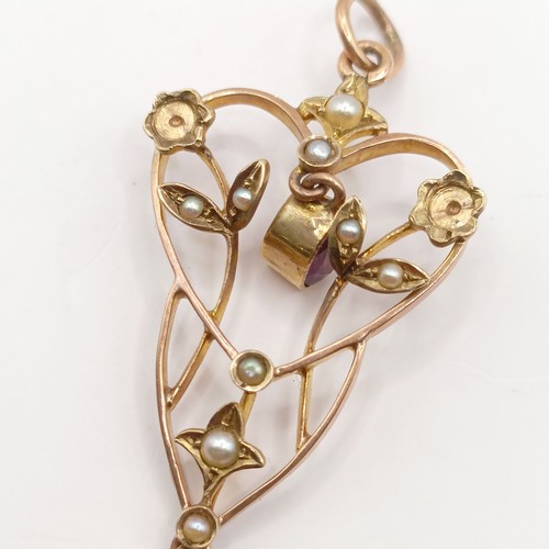 727 - A early 20th century yellow metal, amethyst and seed pearl pendant, 40 mm long approx.