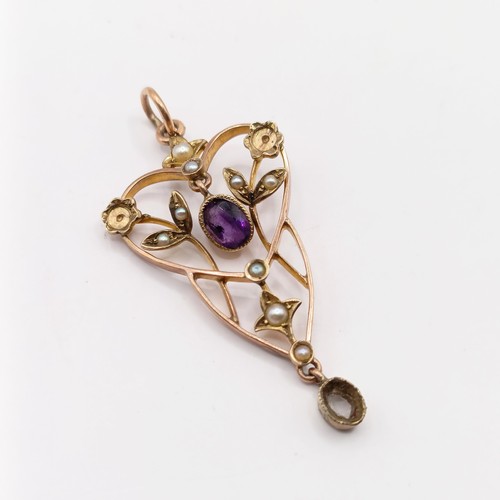 727 - A early 20th century yellow metal, amethyst and seed pearl pendant, 40 mm long approx.