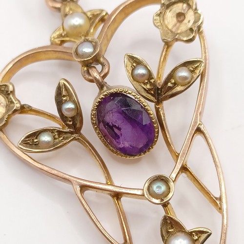 727 - A early 20th century yellow metal, amethyst and seed pearl pendant, 40 mm long approx.