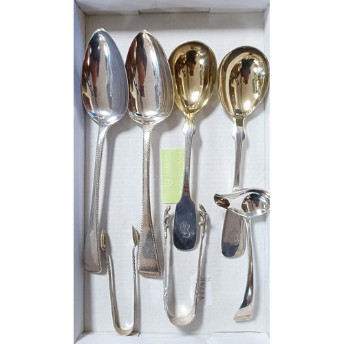 765 - A George III silver Old English pattern spoon, four other spoons and two pairs of sugar tongs, vario... 