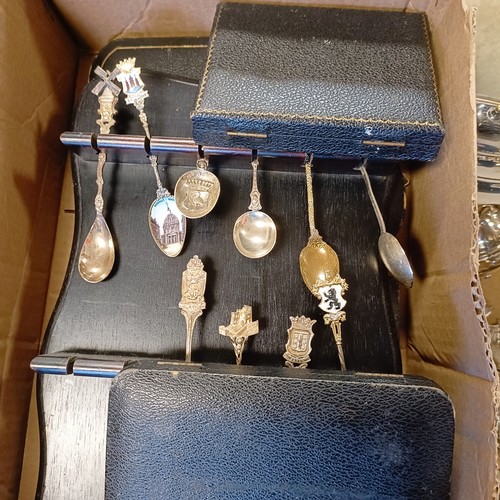 767 - A set of six silver coloured metal and multi coloured enamel coffee spoons, cased, assorted commemor... 