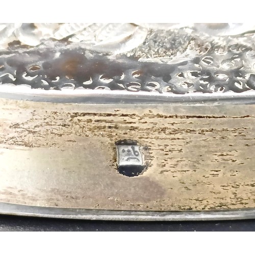 768 - An Indian silver coloured metal hand mirror, 16 cm diameter, another, decorated flowers, 22 cm wide,... 