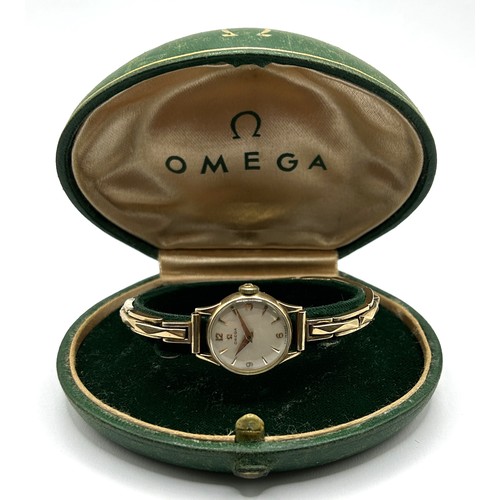 738 - *** Regretfully Withdrawn***  A ladies 9ct gold Omega wristwatch, on an expanding bracelet, 14.4 g (... 