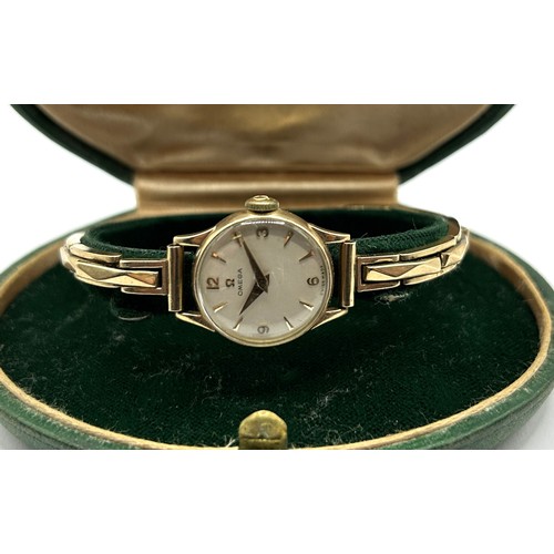 738 - *** Regretfully Withdrawn***  A ladies 9ct gold Omega wristwatch, on an expanding bracelet, 14.4 g (... 