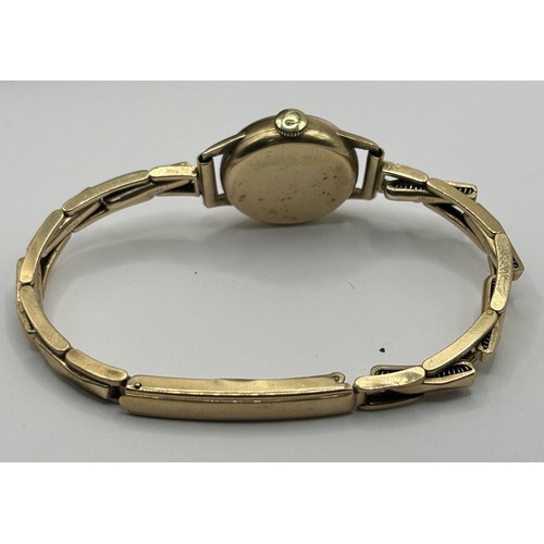 738 - *** Regretfully Withdrawn***  A ladies 9ct gold Omega wristwatch, on an expanding bracelet, 14.4 g (... 