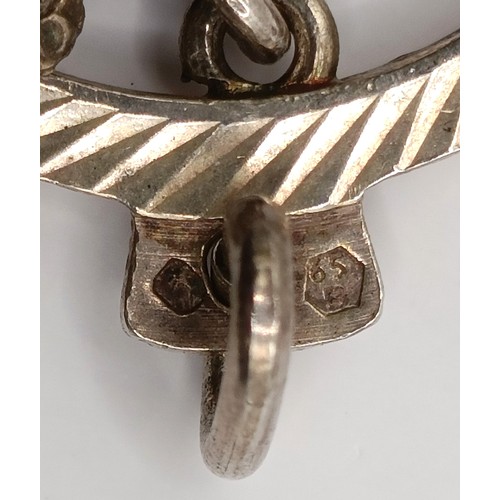724 - An early 20th century silver memorial brooch, other jewellery, and a silver chain, with yellow metal... 