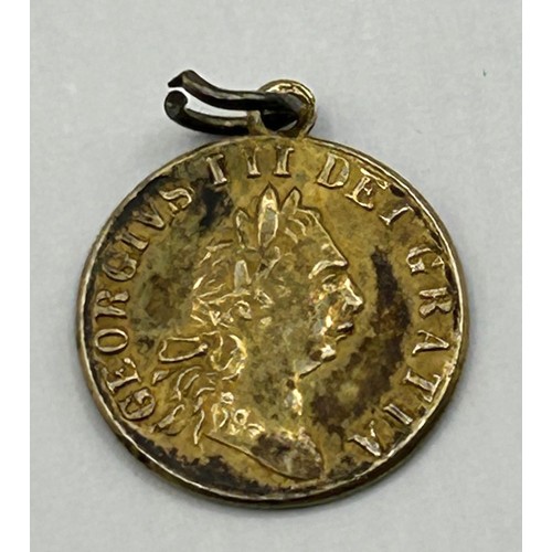 723 - A gold plated token dated 1911, with mount cut, an Art Nouveau gilt metal and enamel buckle, decorat... 