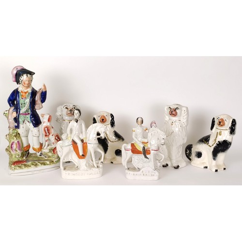 625 - A Staffordshire figure of a hunter, 40 cm high, and six other Staffordshire figures (7)