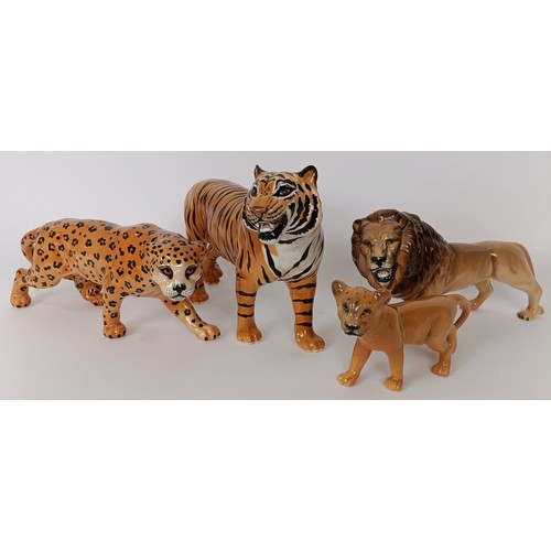 622 - A Beswick figure of a tiger, 28 cm wide and three Beswick figures of big cats (4)