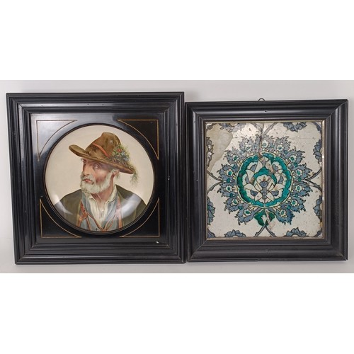 623 - An Isnik style tile, framed, broken and repaired, 25 x 25 cm, and a Continental plate, decorated por... 