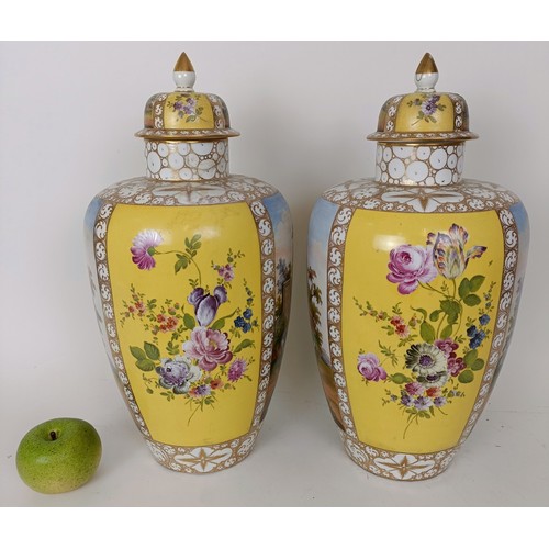 626 - A pair of Vienna style vases and covers, decorated landscapes and flowers, 40 cm high (2)