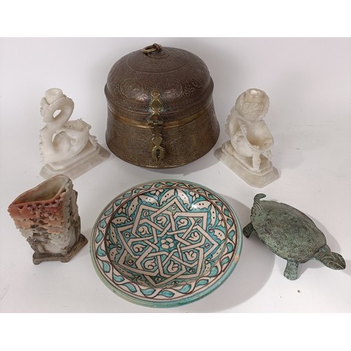 629 - An Eastern brass caddy, a pair of soapstone carvings, an Isnik plate, and other items (6)