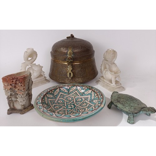 629 - An Eastern brass caddy, a pair of soapstone carvings, an Isnik plate, and other items (6)