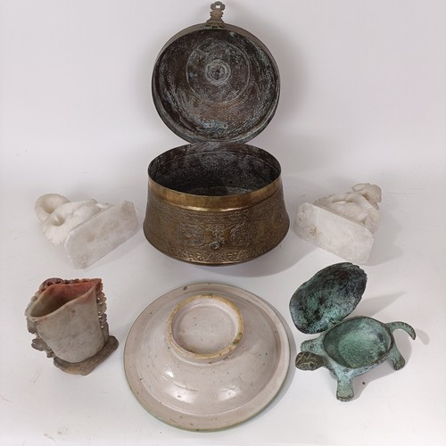 629 - An Eastern brass caddy, a pair of soapstone carvings, an Isnik plate, and other items (6)