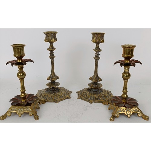 638 - A pair of brass and copper candlesticks 15 cm high, and a pair of brass candlesticks, 20 cm high (4)... 