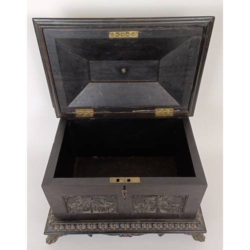 645 - A 19th century Anglo Indian carved ebony box, 30 cm wide