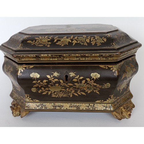 647 - A 19th century lacquered box, decorated in the Chinese manner, 26 cm wide