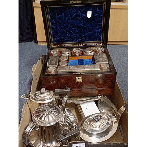 651 - A 19th century walnut dressing table case, fitted with various cut glass bottles and boxes, with sil... 