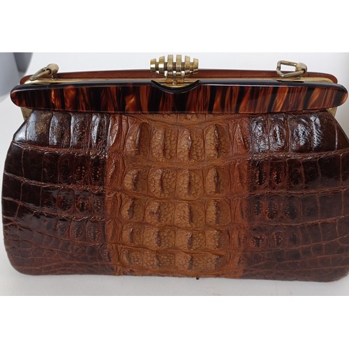 655 - A crocodile skin brief case and similar handbag (2)