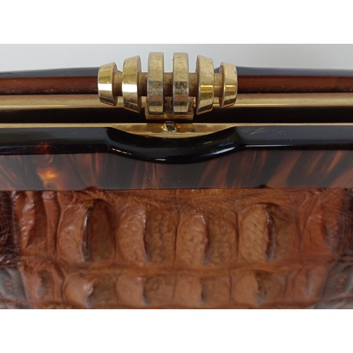 655 - A crocodile skin brief case and similar handbag (2)